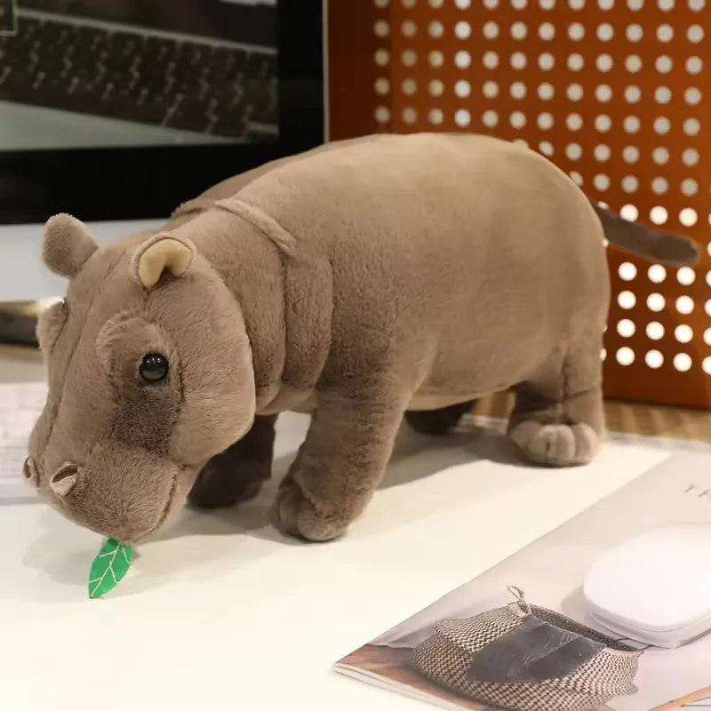 Front view of a realistic hippo plush stuffed animal with rounded ears, short legs, and soft grey body