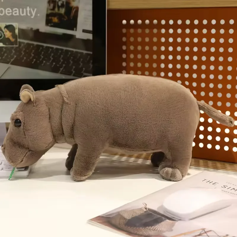 Side view of a realistic hippo plush toy showing a rounded back, short legs, and shelf-friendly seated profile