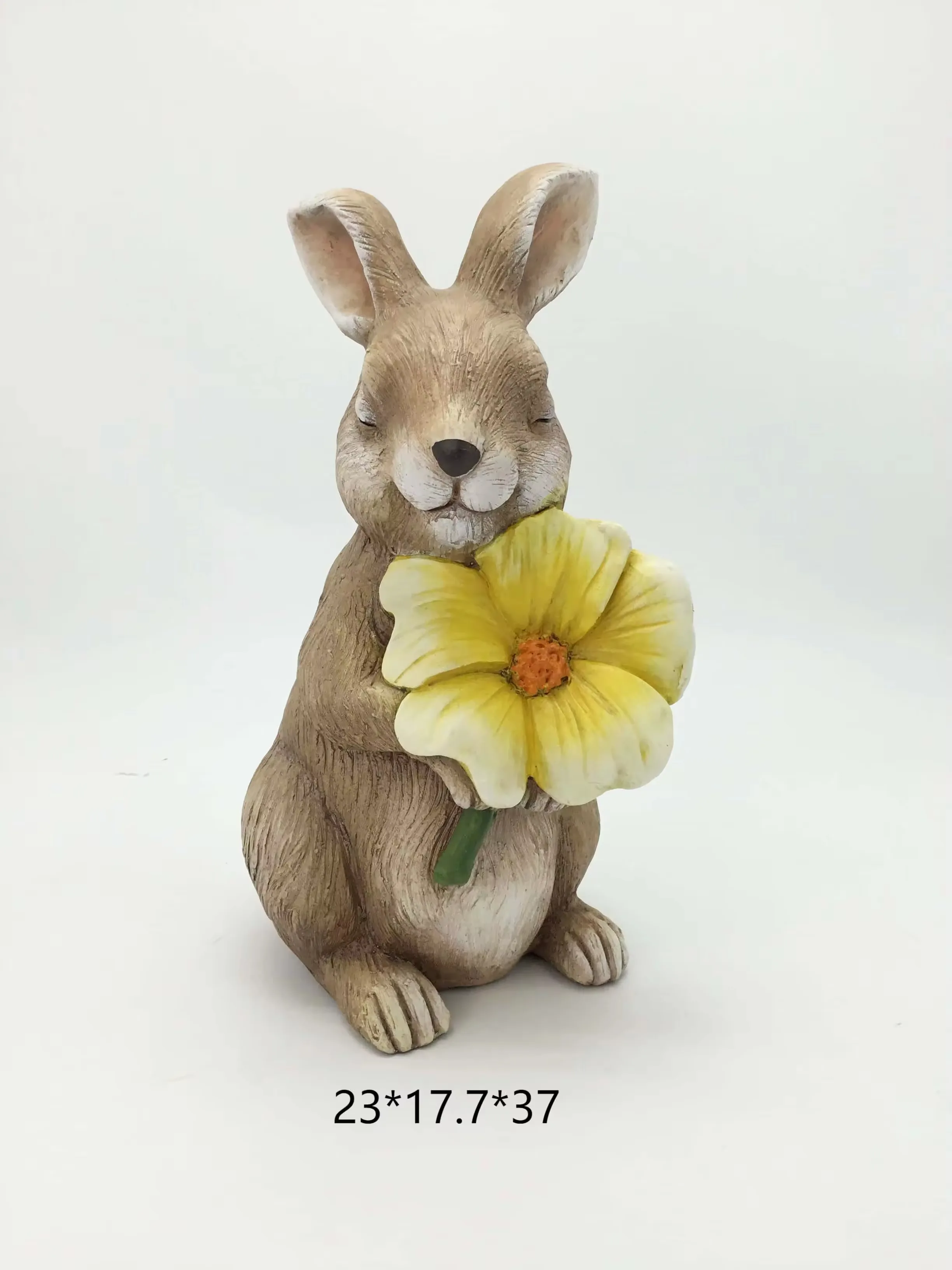 Realistic hand-painted resin rabbit figurine holding a yellow flower for Easter gift and spring tabletop decor