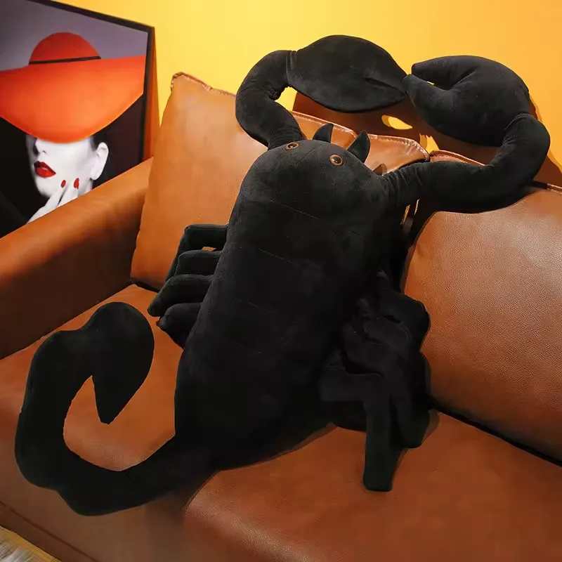 Rear angle of black scorpion plush doll showing body fullness, stitched segments, and raised claw span