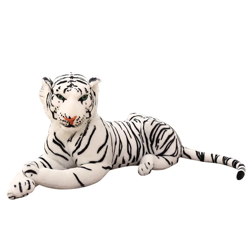 Tiger plush doll detail showing striped fabric panels, soft fur texture, and filled paw construction