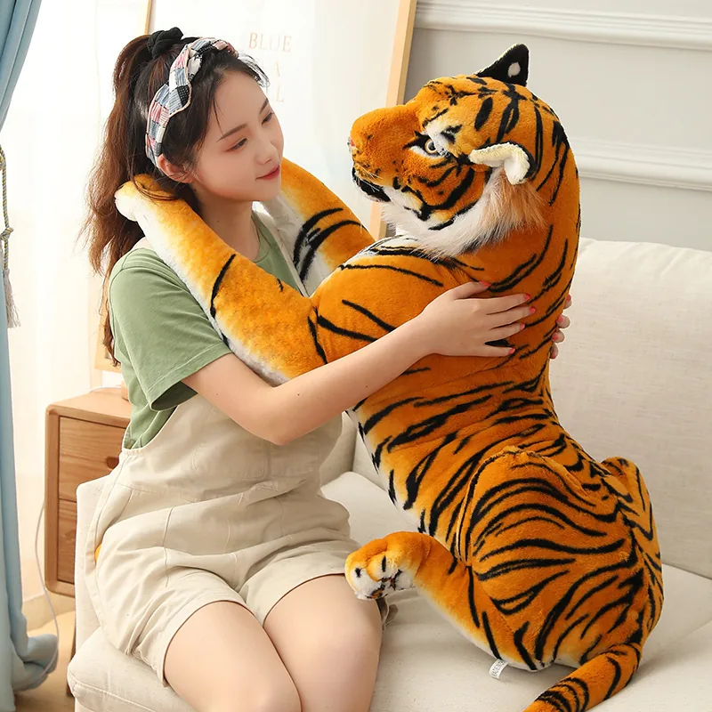 Tiger plush doll shown in a seated display pose with rounded paws and striped body panels