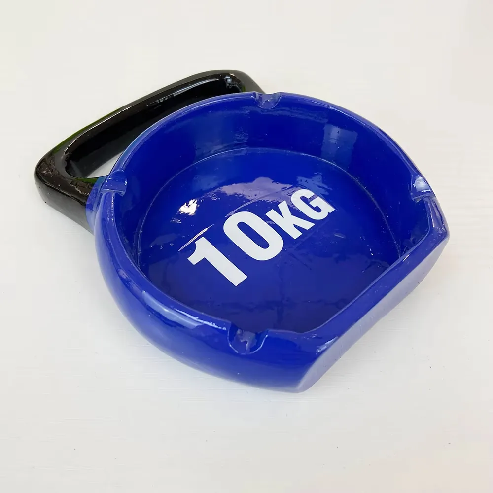 Close detail of a hand-painted resin ashtray with sports barbell design