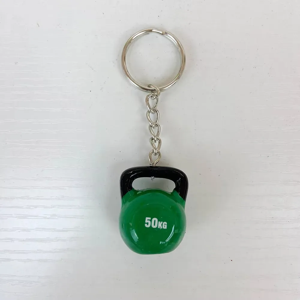 Front view of a green 50KG kettlebell resin keychain with metal ring and chain