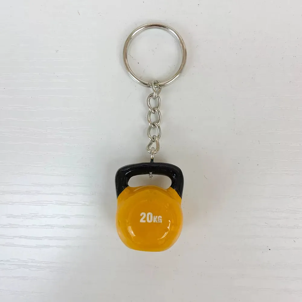 Front view of a yellow 20KG kettlebell resin keychain with black handle and hanging chain