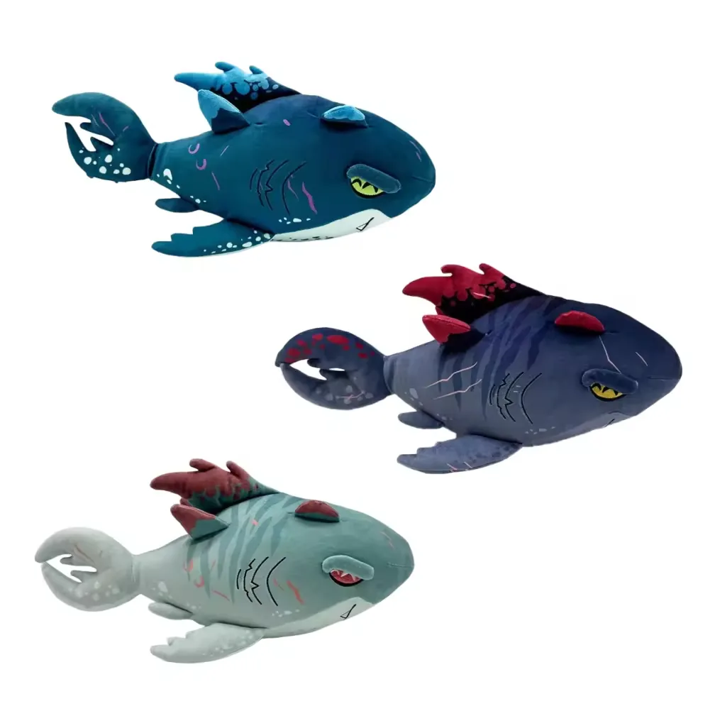 Three Shadowmaw Megalodon plush dolls shown in teal, midnight blue, and seafoam colorways with fantasy fins and curled tails