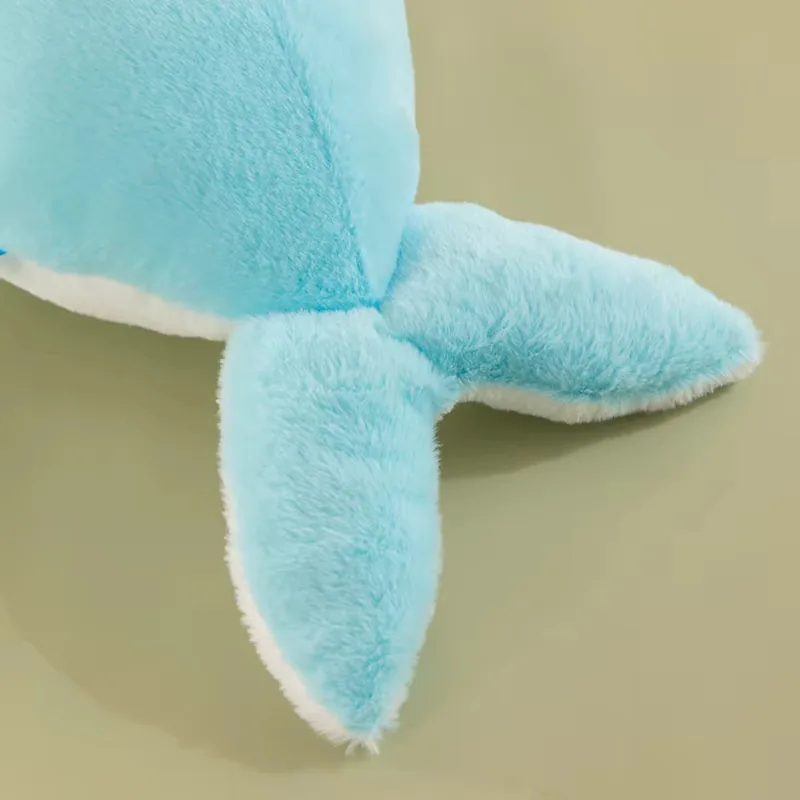 Tail and side fin detail on the blue dolphin plush pillow
