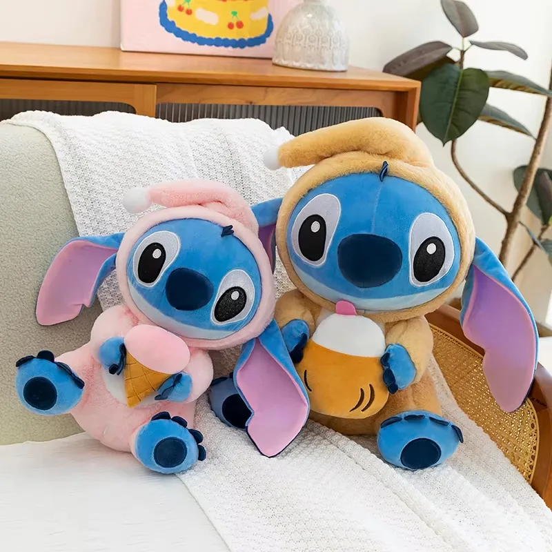 Pink and tan Stitch hooded plush dolls seated together on a sofa with ice cream and drink accessories