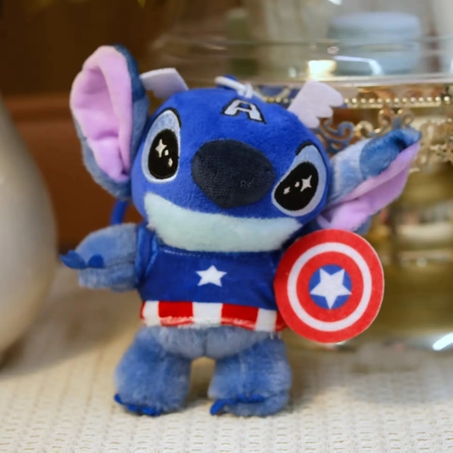 Captain-style Stitch keychain plush with shield and blue costume details