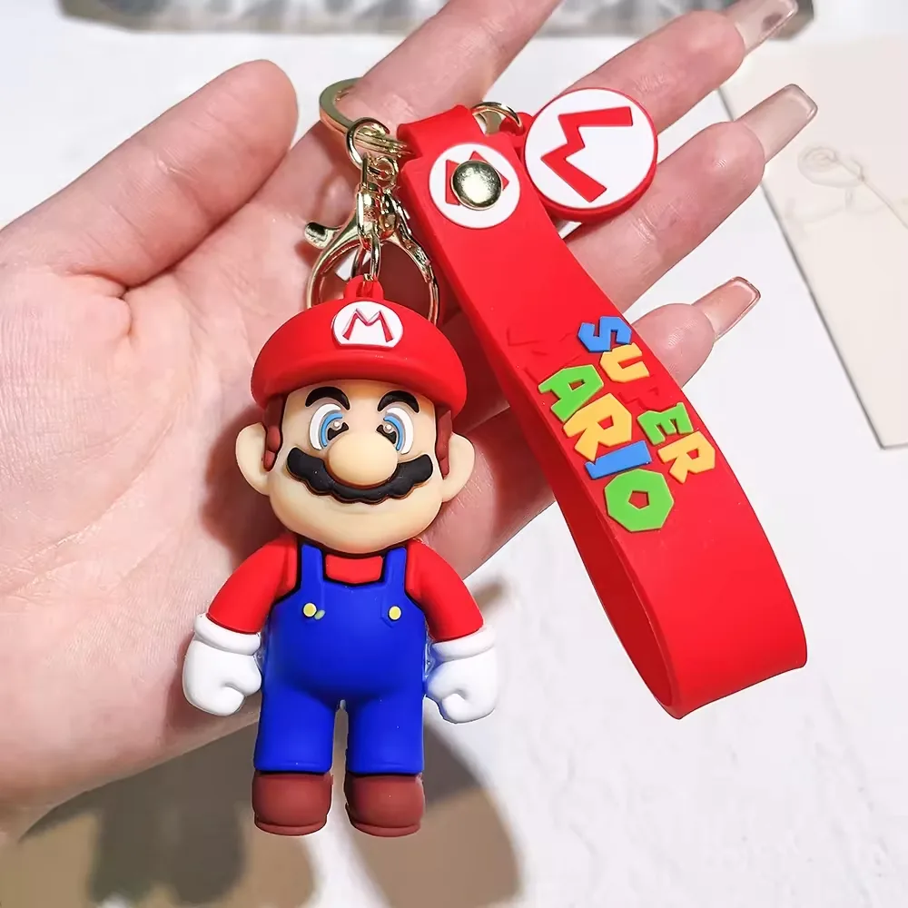 Red plumber-style Super Mario Bros PVC keychain with molded 3D cartoon details and metal split ring