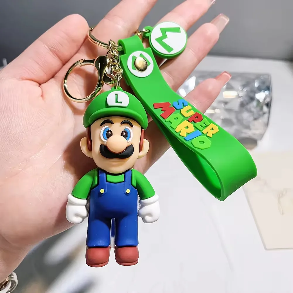 Green plumber-style Super Mario Bros PVC keychain with molded cap detail and metal key ring