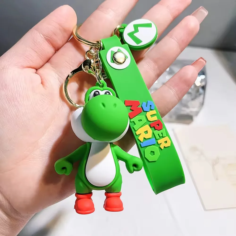 Yoshi-style green dinosaur PVC keychain with rounded 3D body and hanging ring