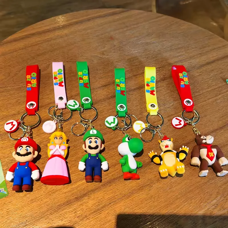 Super Mario Bros promotional gift keychains shown as a multi-SKU character display with compact hanging formats