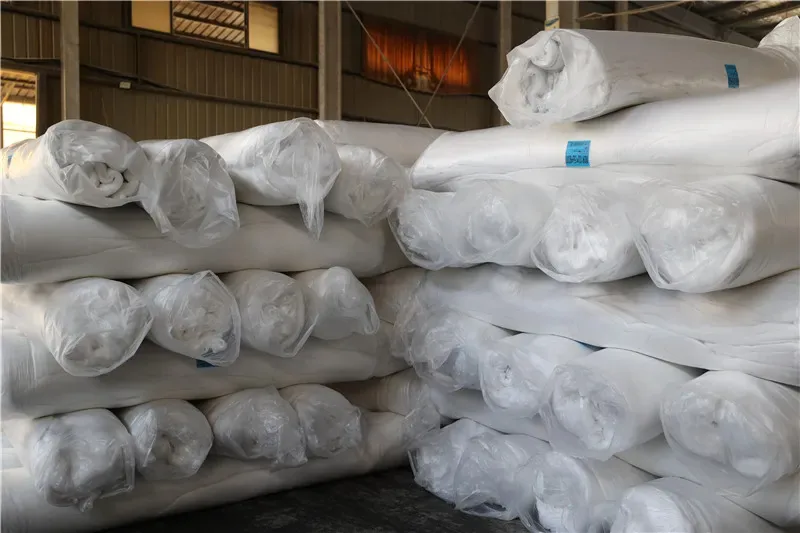 High-quality polyester fiberfill bales stacked in a warehouse ready for plush toy stuffing